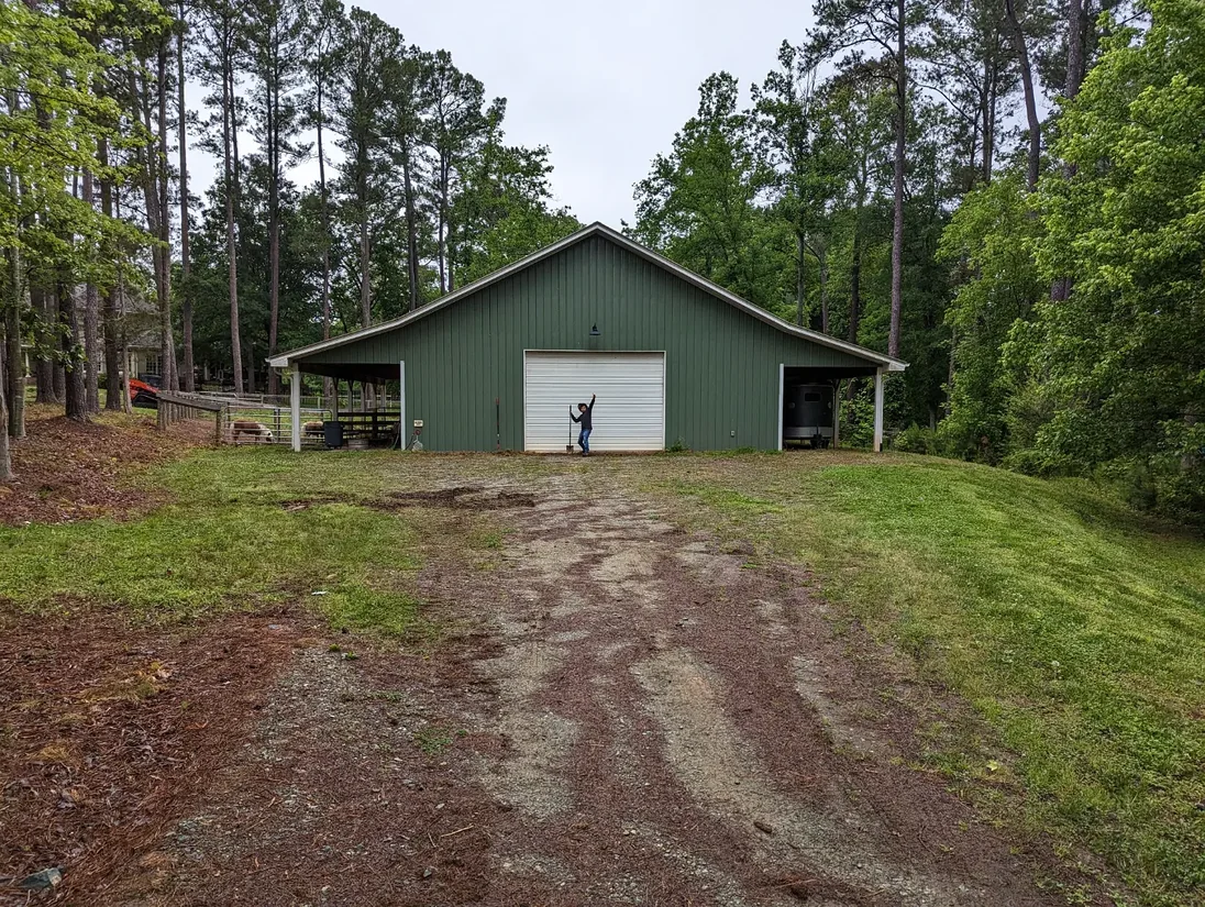 Before gravel driveway repair — ruts and potholes